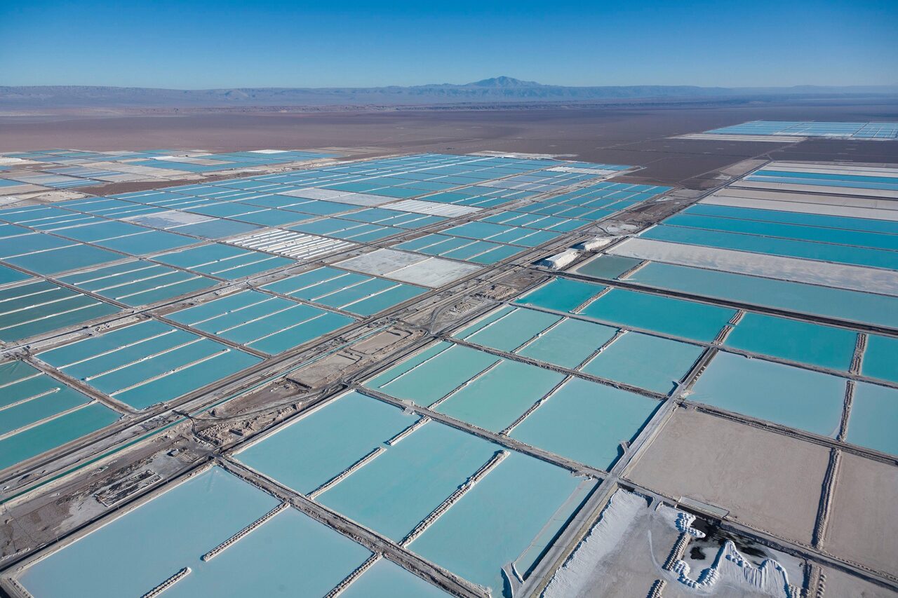 Chile, Antofagasta region, San Pedro de Atacama, Atacama salar, the world’s largest lithium deposit, evaporation ponds of the Sociedad Quimica Mineral de Chile lithium mine or SQM and Sociedad Chilena del Litio or SCL (aerial view)