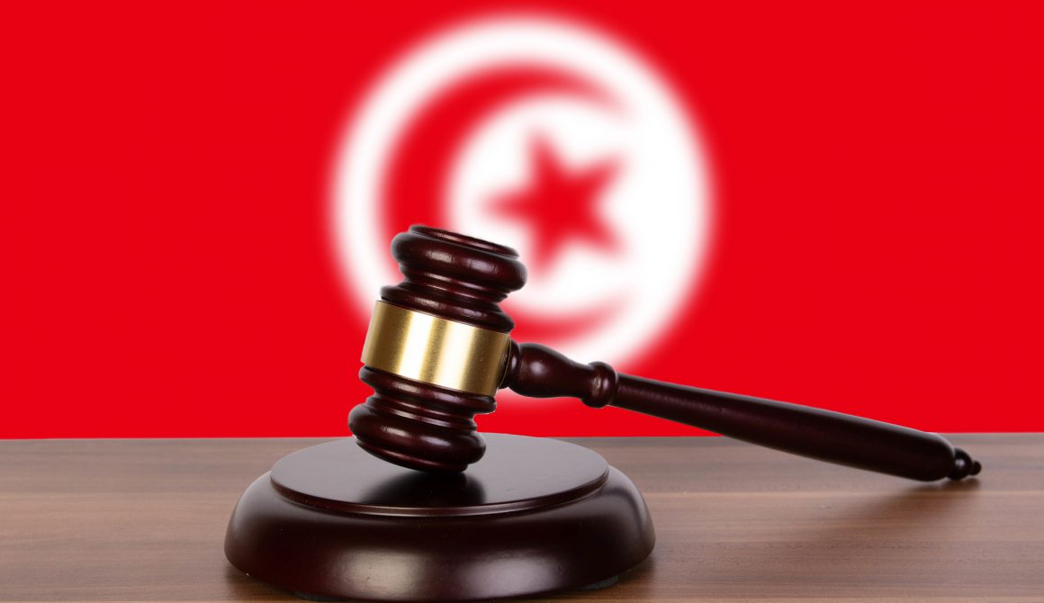 Wooden gavel and flag of Tunisia