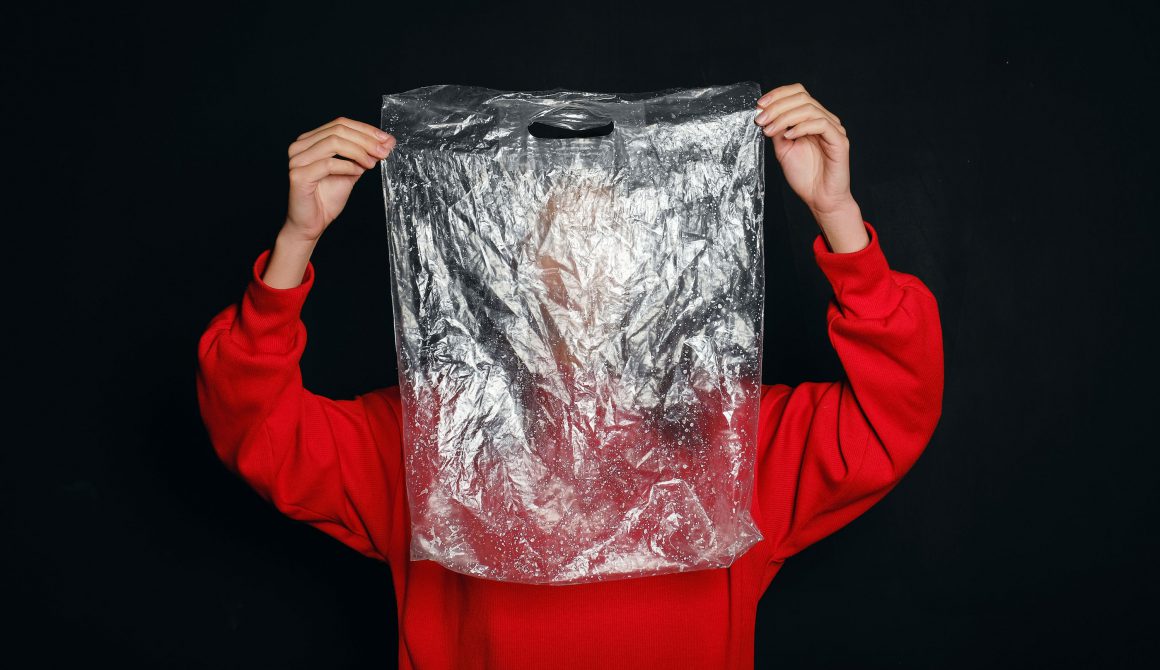 person-holding-a-plastic-bag-3645507