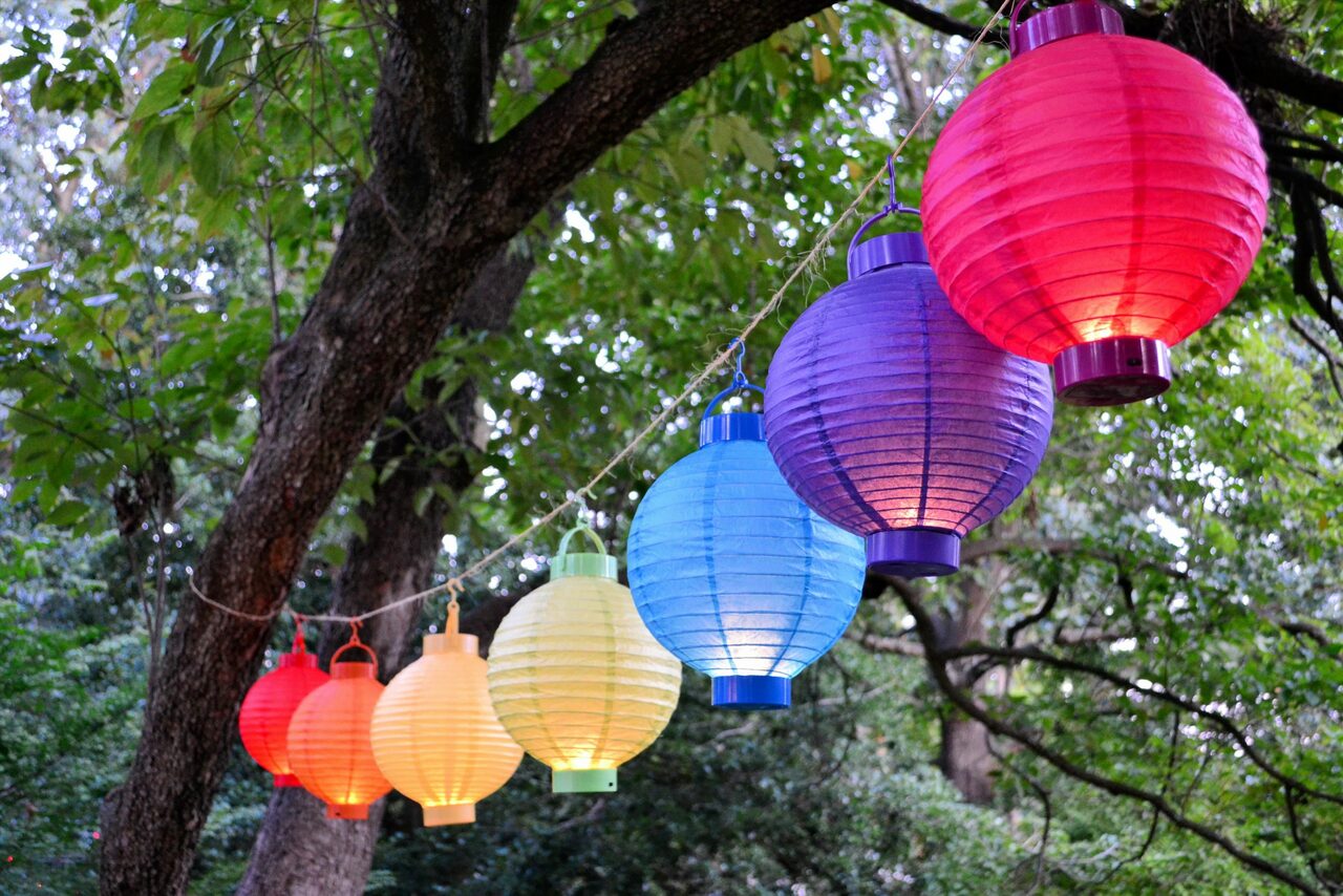 decorating-the-trees-with-chinese-lanterns-for-a-p-2021-08-29-14-57-08-utc-scaled