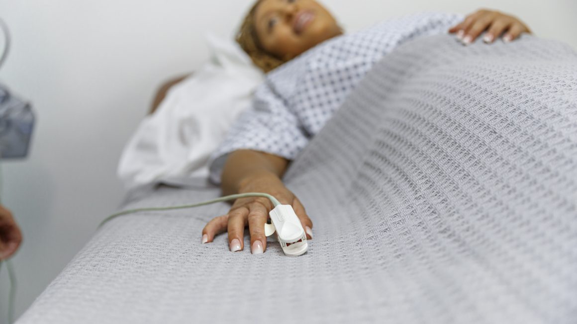 African American woman in hospital bed